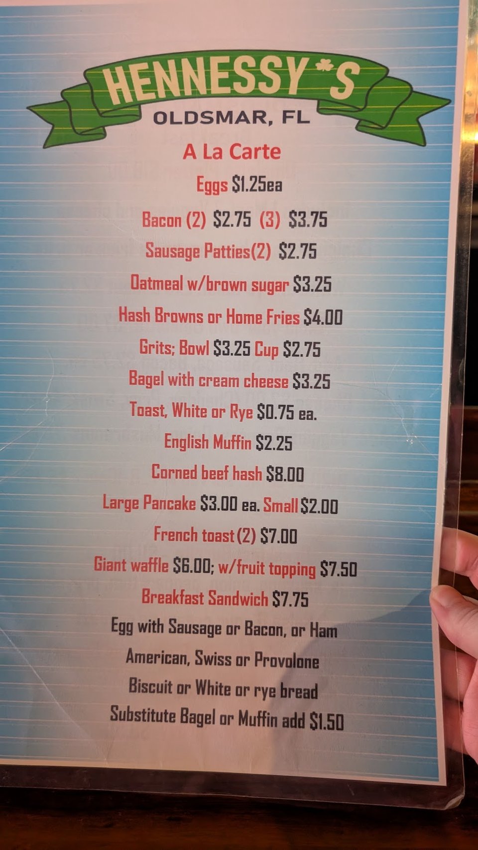 Breakfast sandwich menu with eggs, bacon, and cheese.