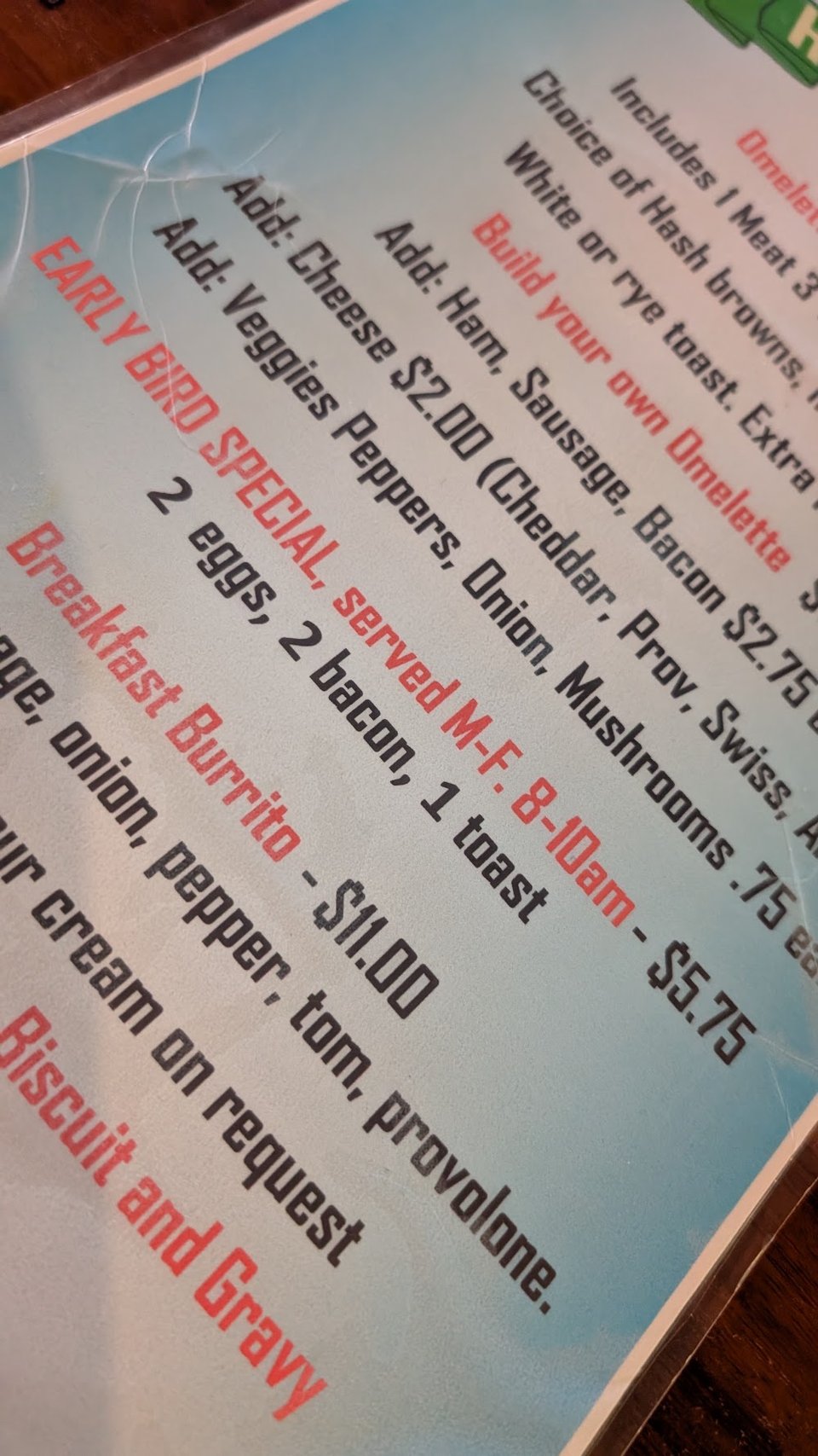 Simple menu layout with breakfast and a la carte items.